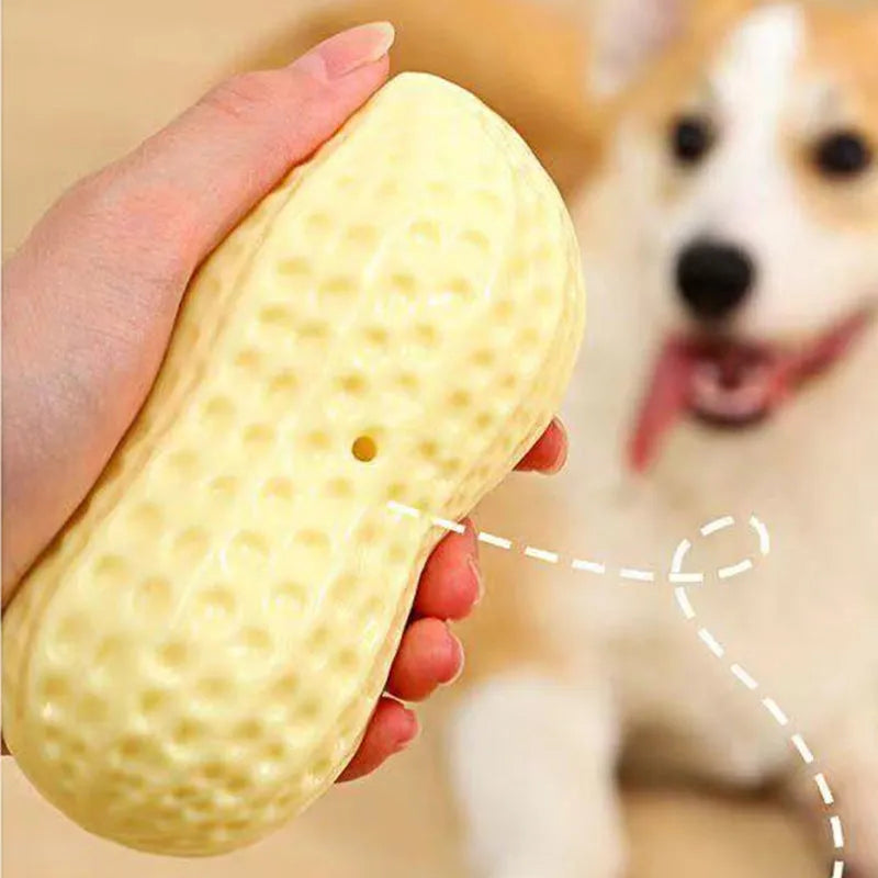 Yellow peanut-shaped dog chew toy with textured surface for dental cleaning