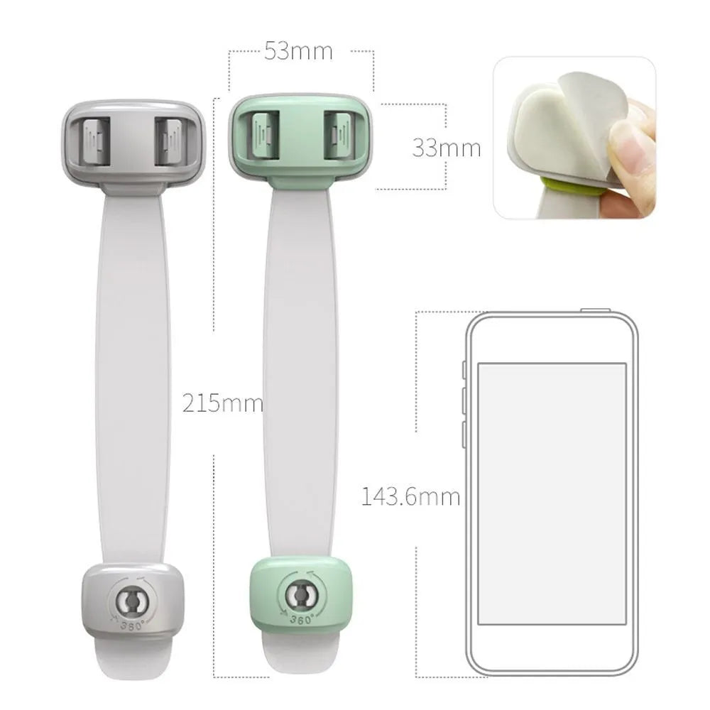 Grey and green adjustable child safety cabinet locks with adhesive backing on a kitchen drawer.
