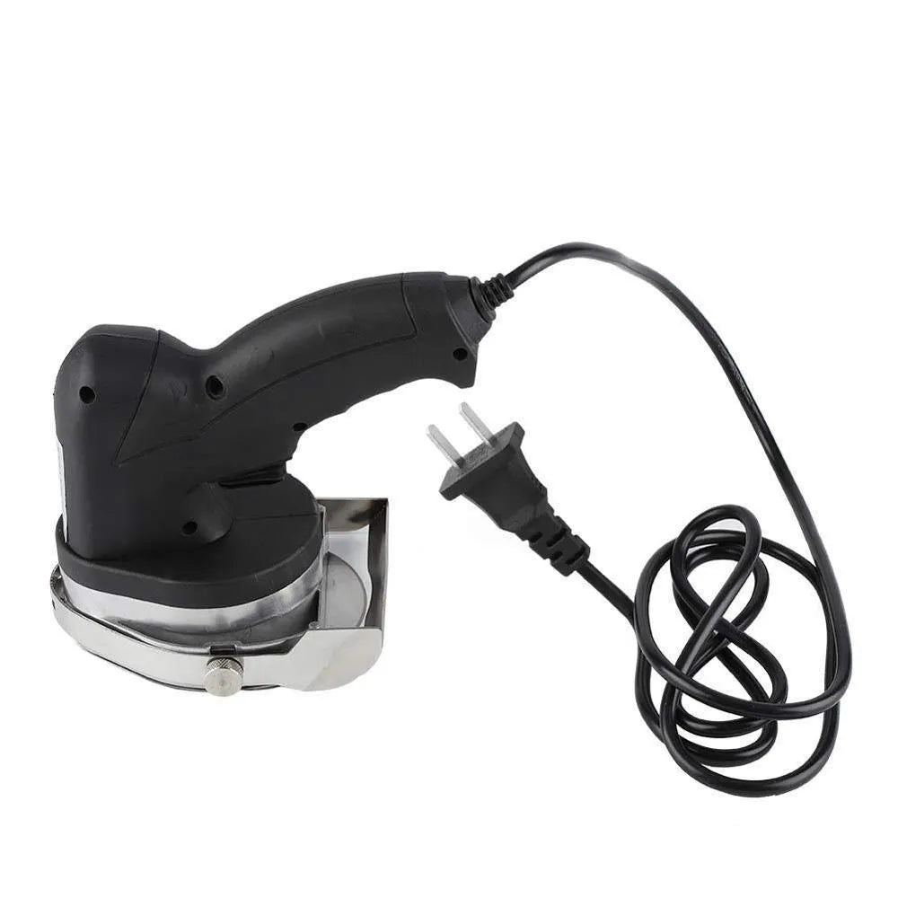 Black electric meat cleaver with power cord and EU plug for turkey barbecue preparation.
