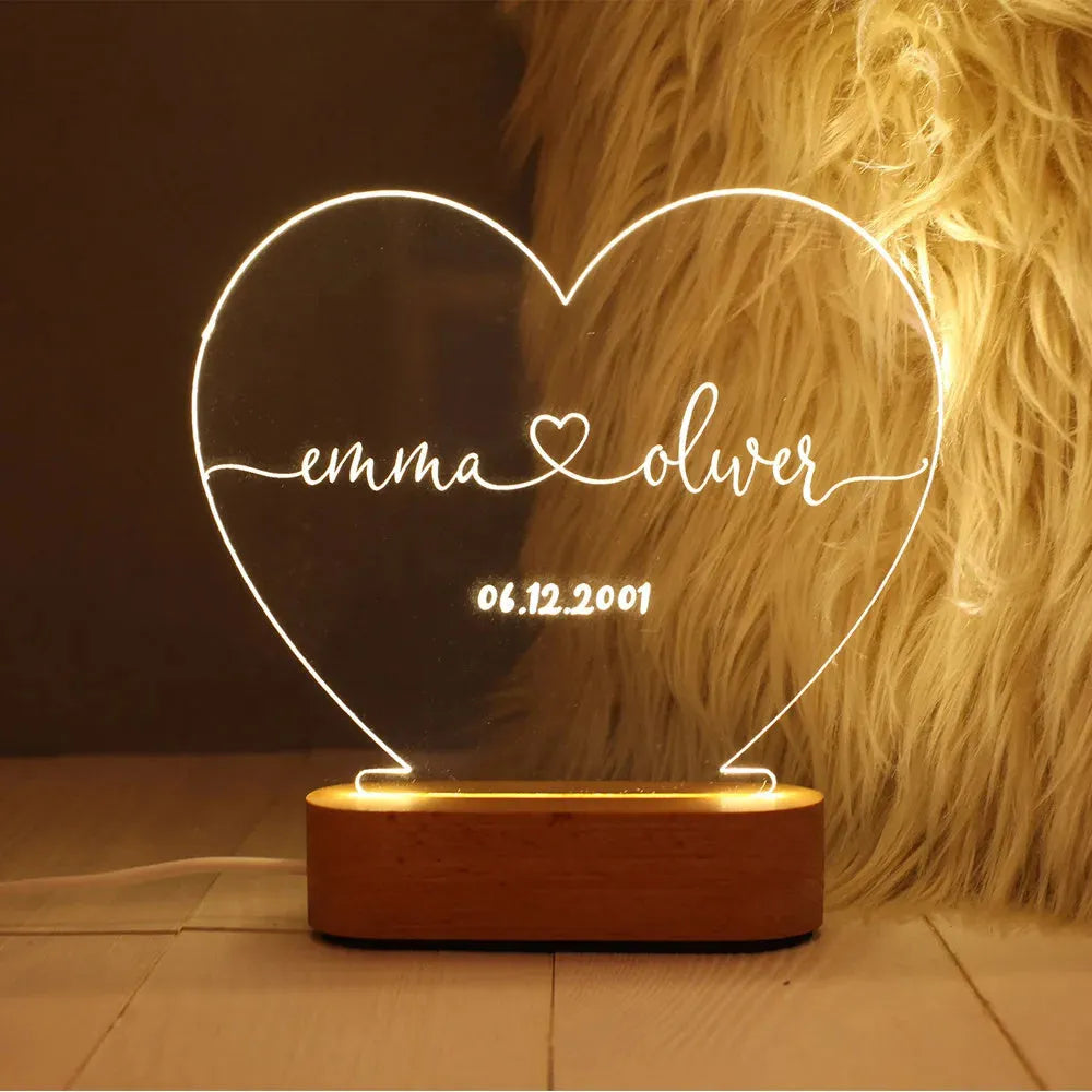 Personalised acrylic night light displaying custom names and date for Valentine's Day gift.