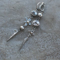 Geometric XINGX pendant earrings in antique silver with rhinestone detailing