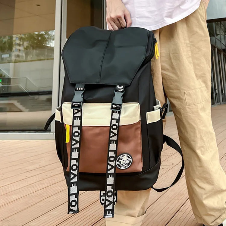 Oxford cloth student backpack in black, green, or red, showing handheld and shoulder straps.