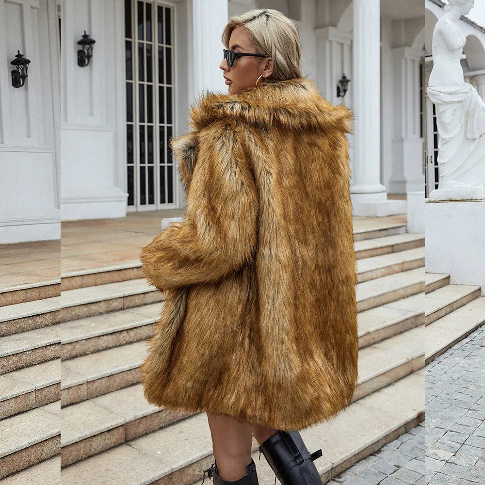 Yellow loose-fitting women's faux fur coat with regular sleeves on a model.