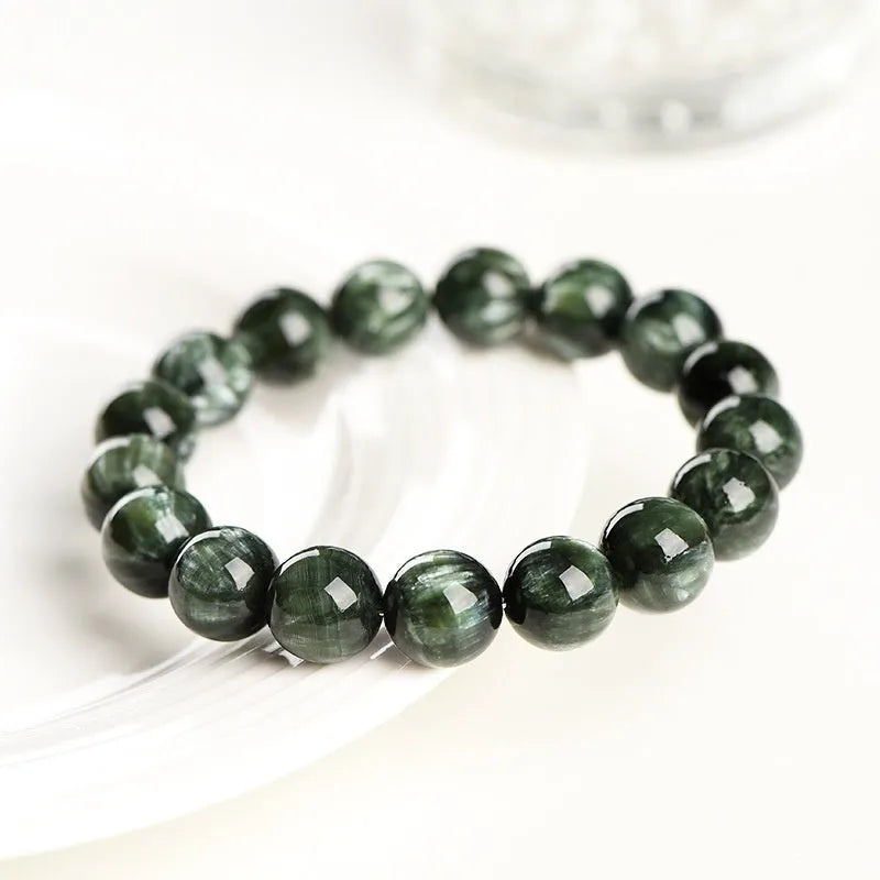 Unisex green dragon crystal bracelet with 8-9mm round beads and a Ruyi charm.