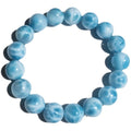 Blue Maillard style bodhi bracelet with natural crystal, sea-pattern stone, and pearls on a white background.