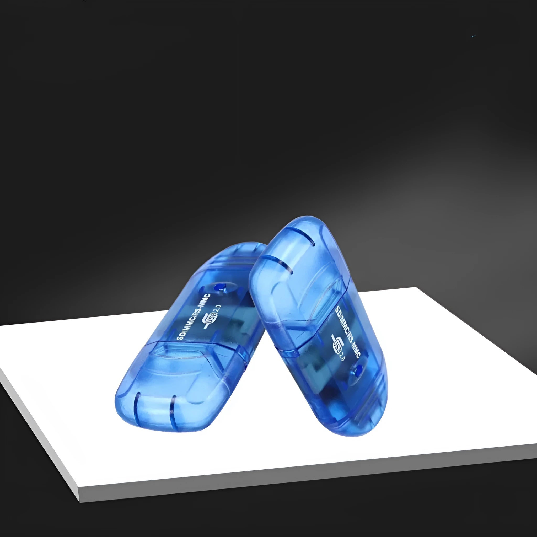 Transparent plastic USB card reader with LED light showing memory card slots