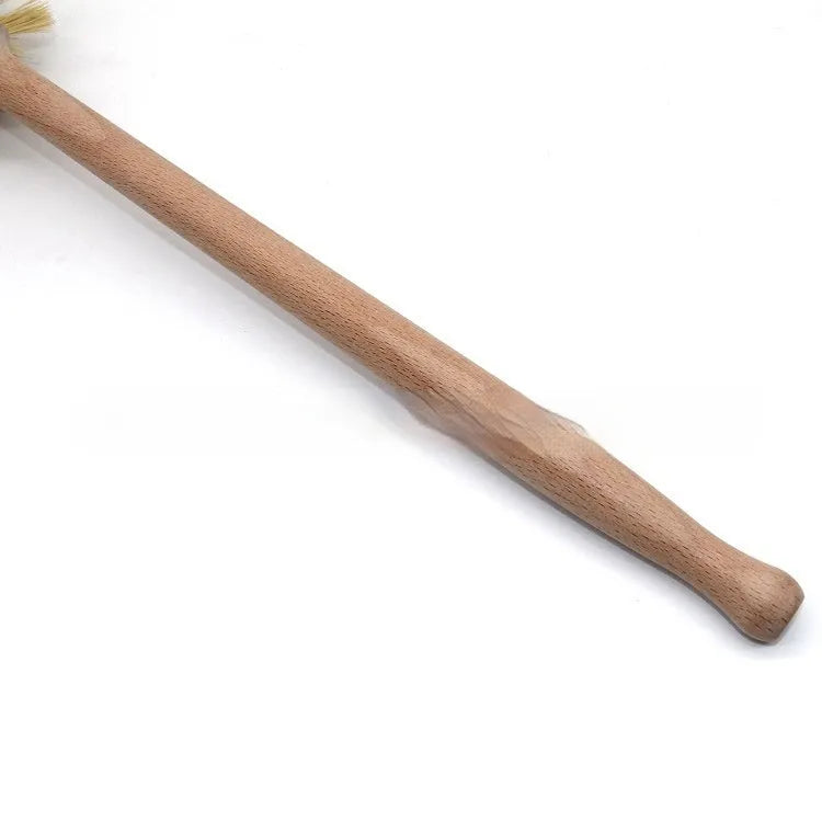 Large long handle cleaning brush with beech wood handle and natural sisal bristles on a wooden surface