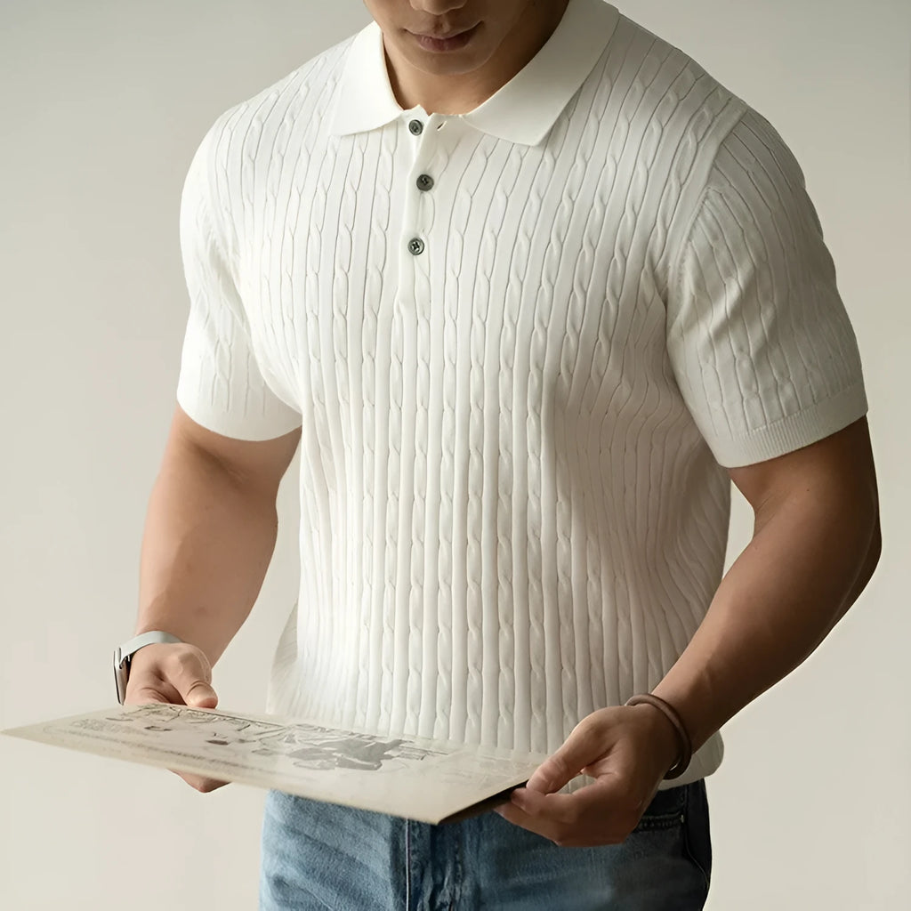 Men's khaki short sleeve business casual top laid flat, showing collar and button placket detail.