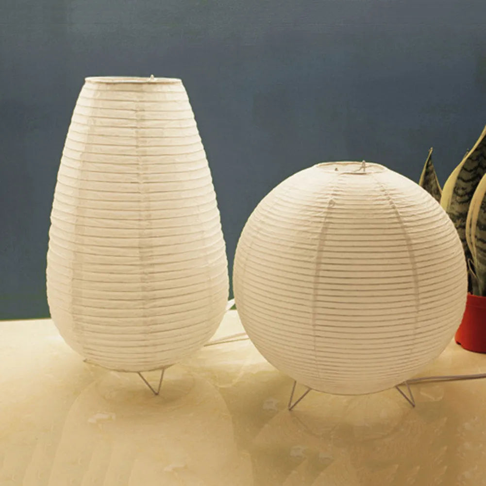 White traditional rice paper table lamp with E14 bulb holder on wooden desk