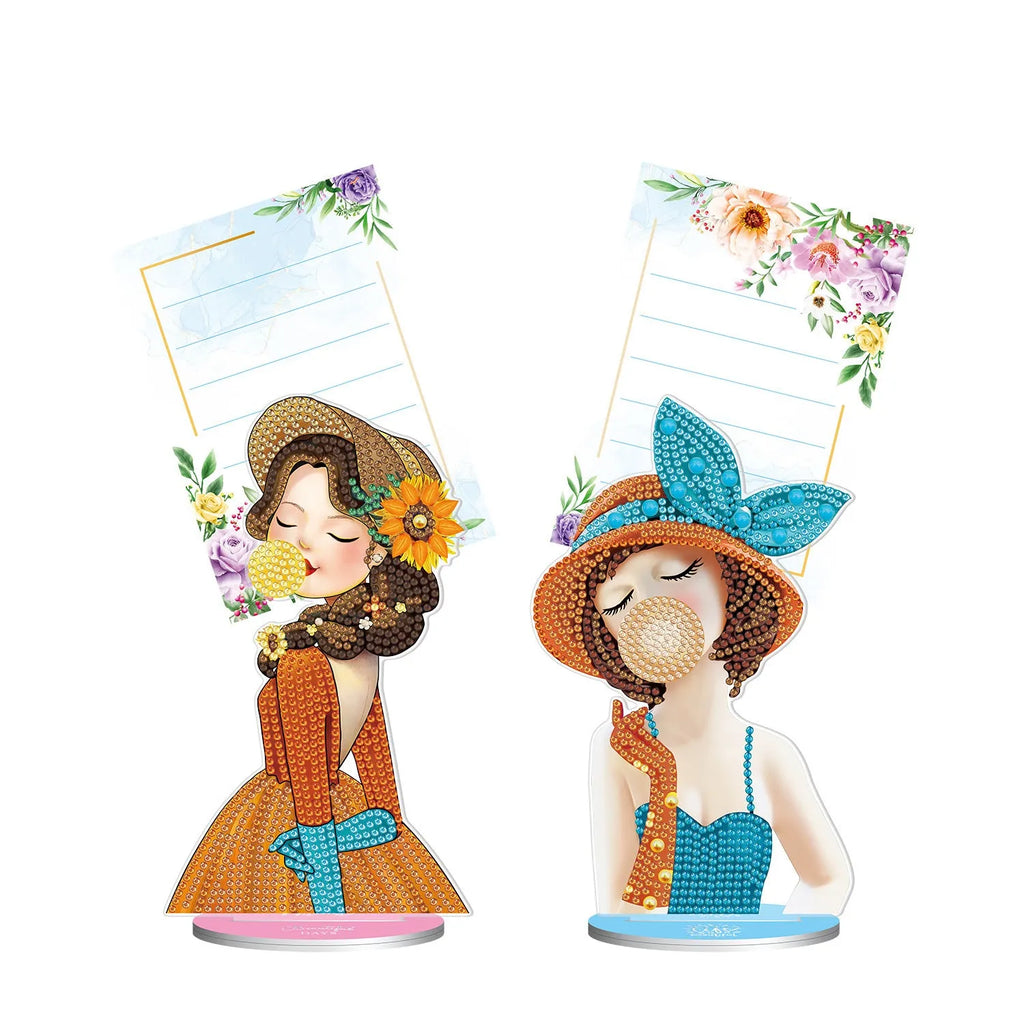 Handmade frameless diamond painting decorative note clip holder on a tabletop.