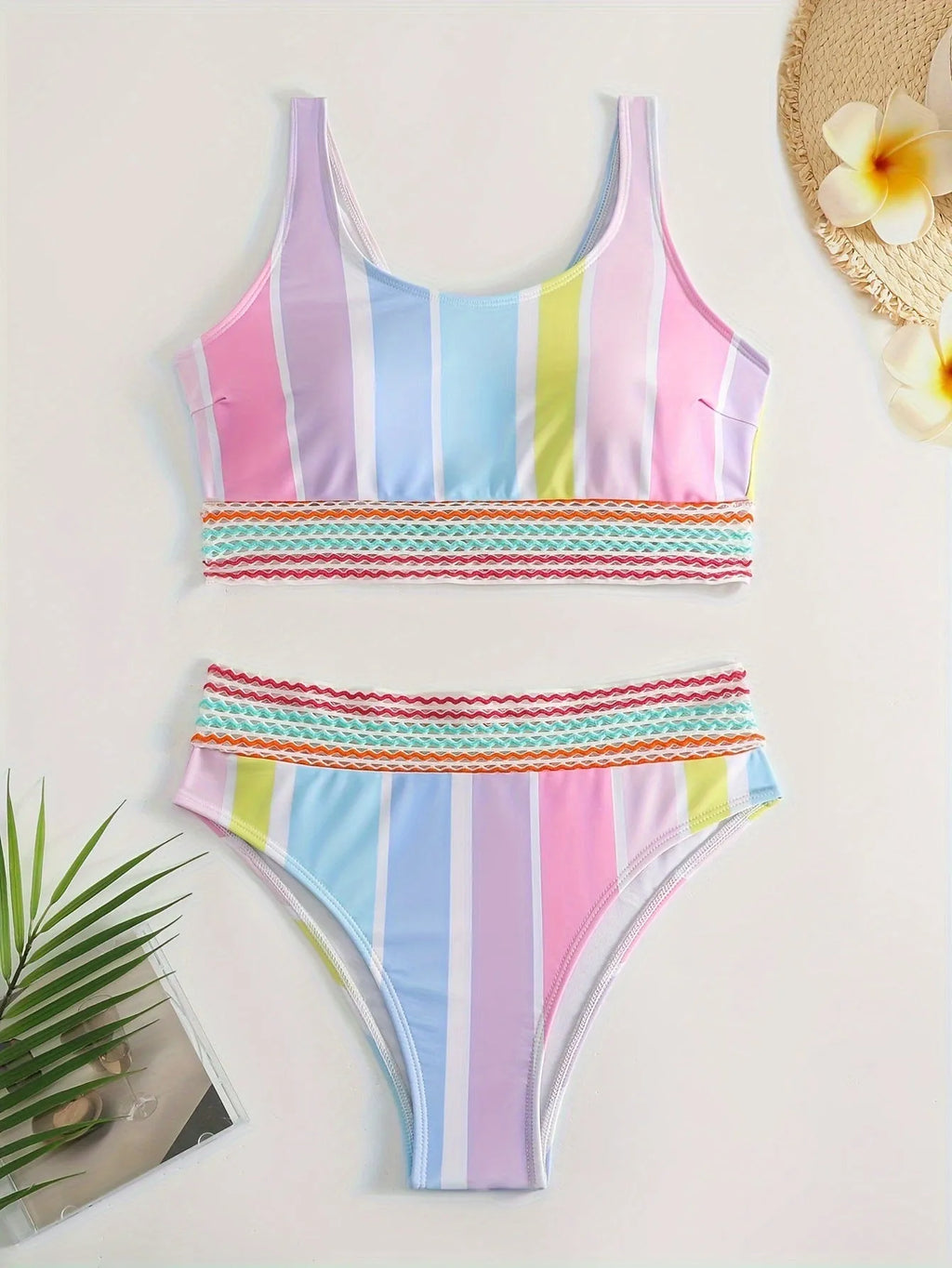Striped women's bikini top and bottom set for sports swimming.