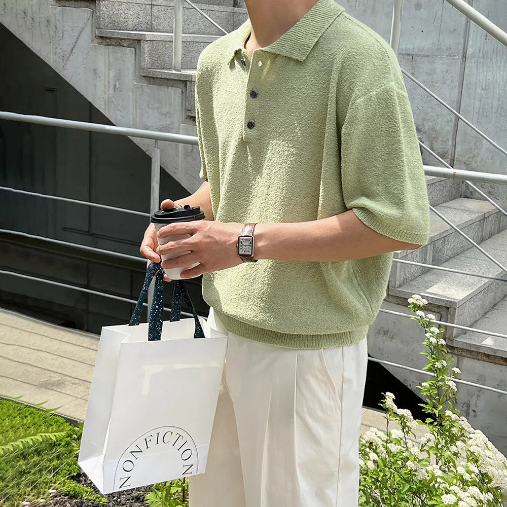 A man's caramel coloured retro knitted polo shirt with short sleeves and an asymmetric design detail.