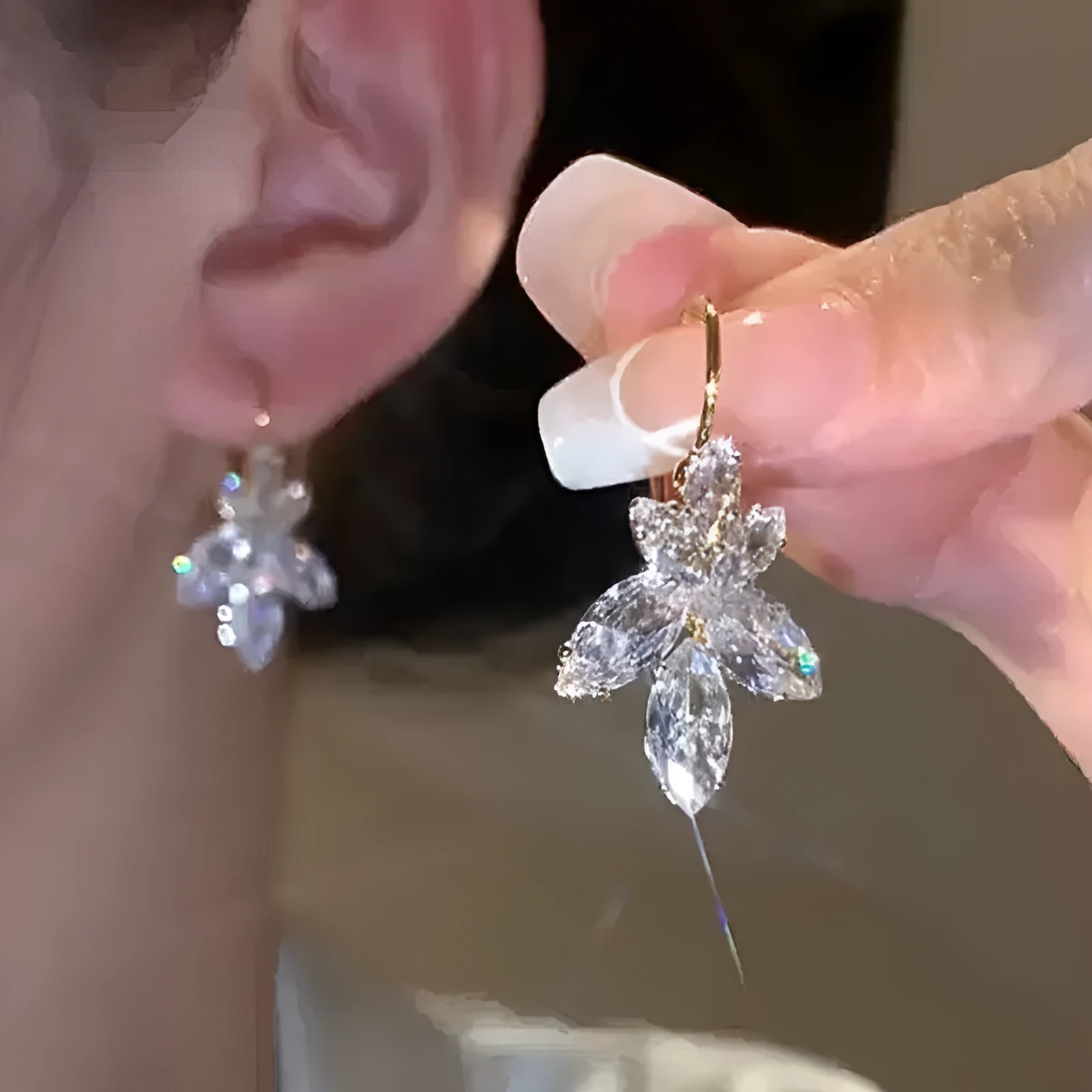 Platinum colour leaf-shaped drop earrings with shiny inlaid zircon details for women.