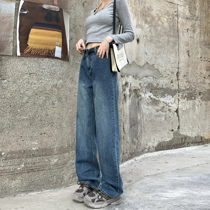 Women's retro blue high waist straight leg jeans on a hanger, showing the classic denim cut.