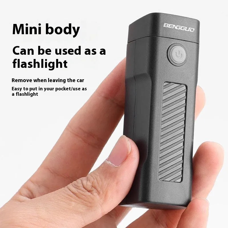 Black USB rechargeable bicycle headlight with quick-release strap mount on handlebars.