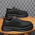 Men's breathable Martin platform boots in black with stitching details and rubber sole, low-top cut