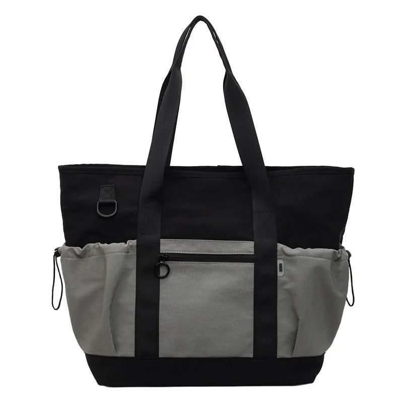 Lightweight Oxford cloth travel bag for women in grey, shown with a letter-pattern lining and holding a yoga mat.