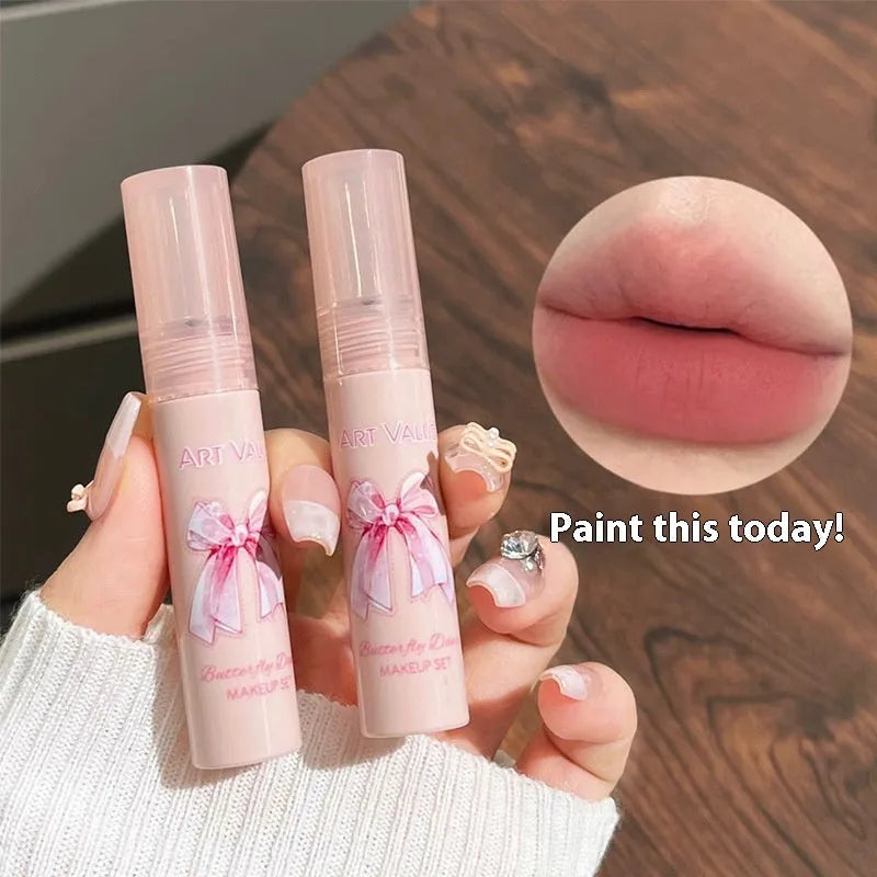 Butterfly Box pink makeup set with four matte lip muds, powder blusher, and necklace