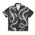 Short sleeve Cuban collar shirt with a snake bone and floral pattern in a loose fit.