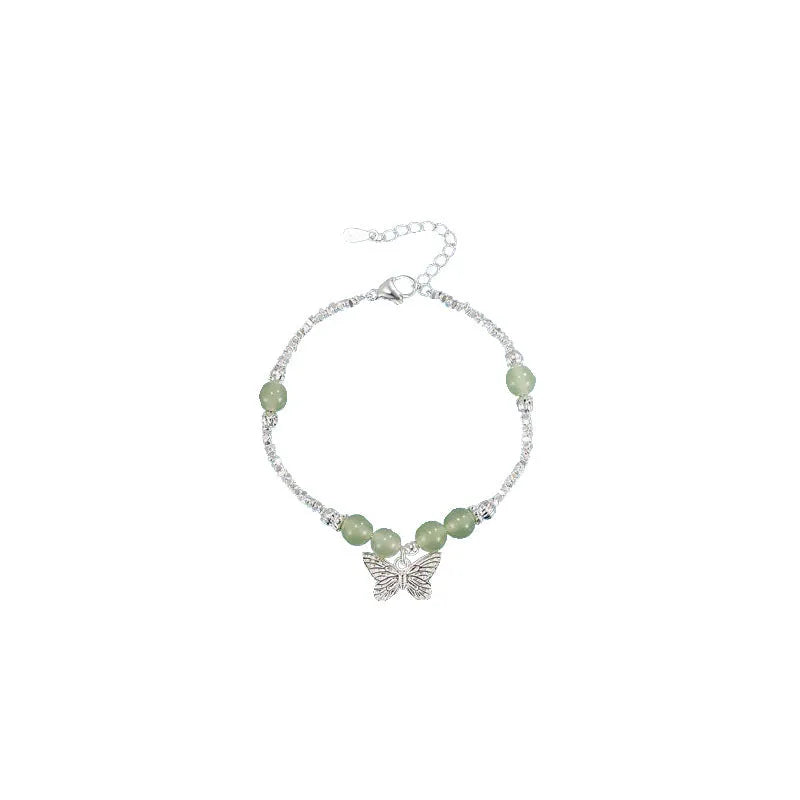 Women's butterfly jewellery set with bracelet and necklace featuring silver electroplated finish and Hetian jade details