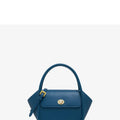 Women's leather wing tote bag in cow leather with a cross-body strap and buckle detail.