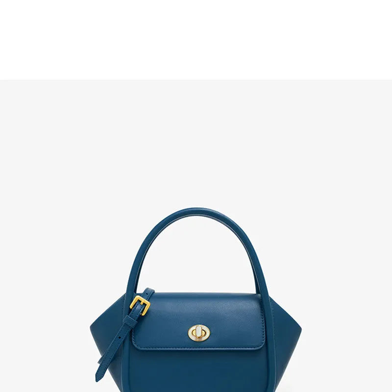 Women's leather wing tote bag in cow leather with a cross-body strap and buckle detail.