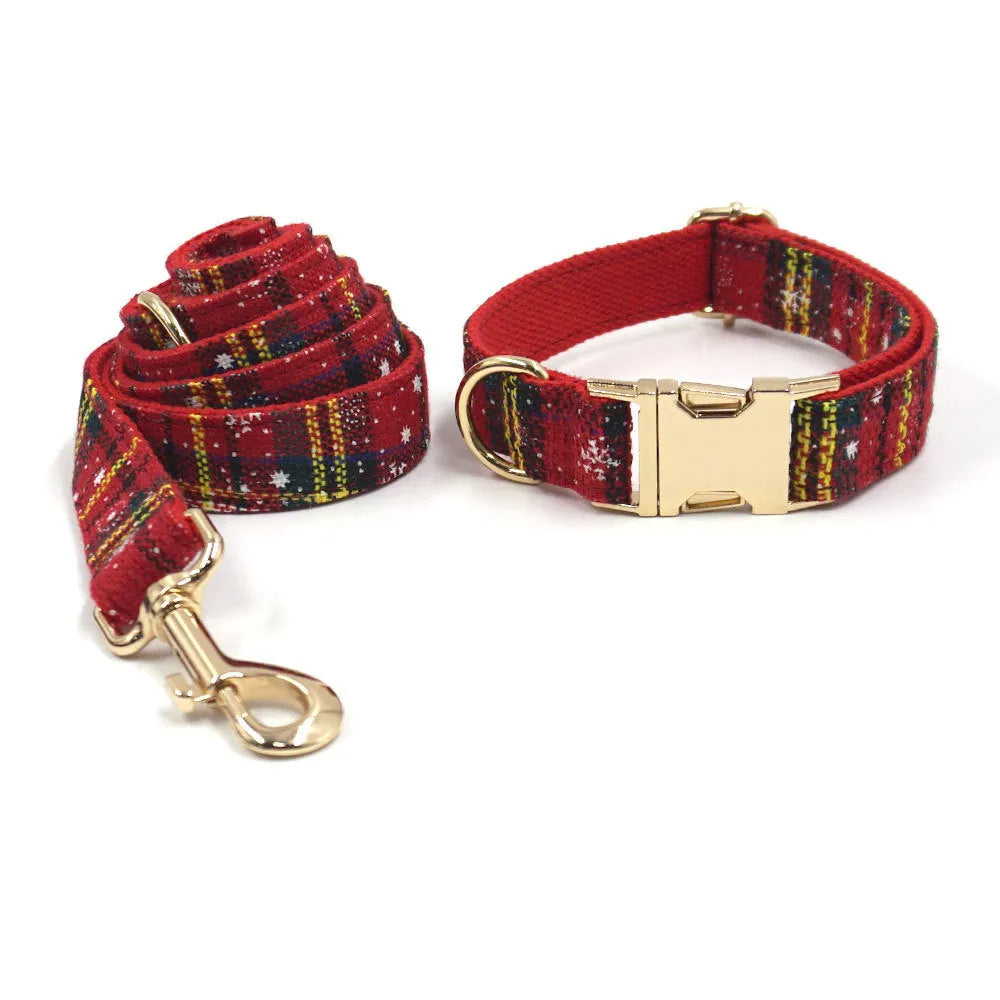 Red Christmas fabric pet collar set with matching harness, rope, bow, and waste bag