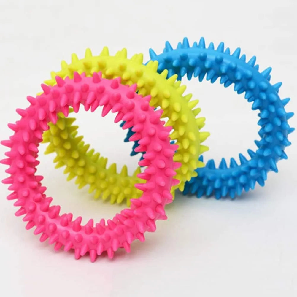 Blue TPR spiky circle ring dog chew toy on a white background.