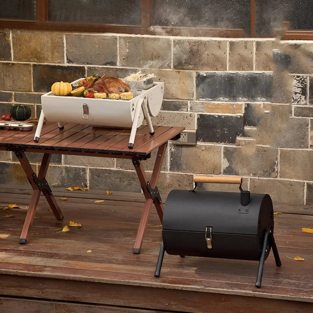 White round portable folding charcoal grill with chimney oven and two mesh racks for frying and baking.