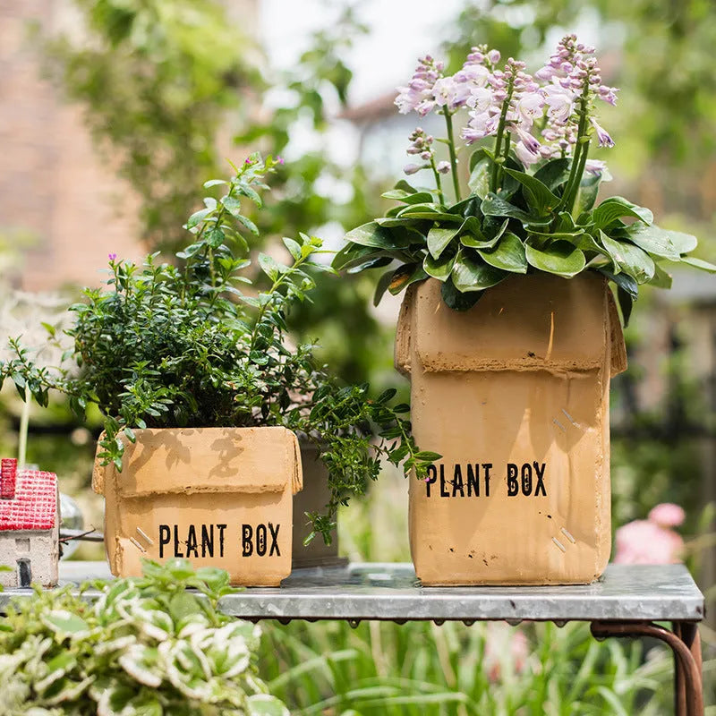Cement brown paper box flowerpot with drainage holes for indoor planting