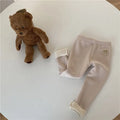 Girl's high-waist fleece-lined winter leggings in solid colour with wool lining and hair band belt.