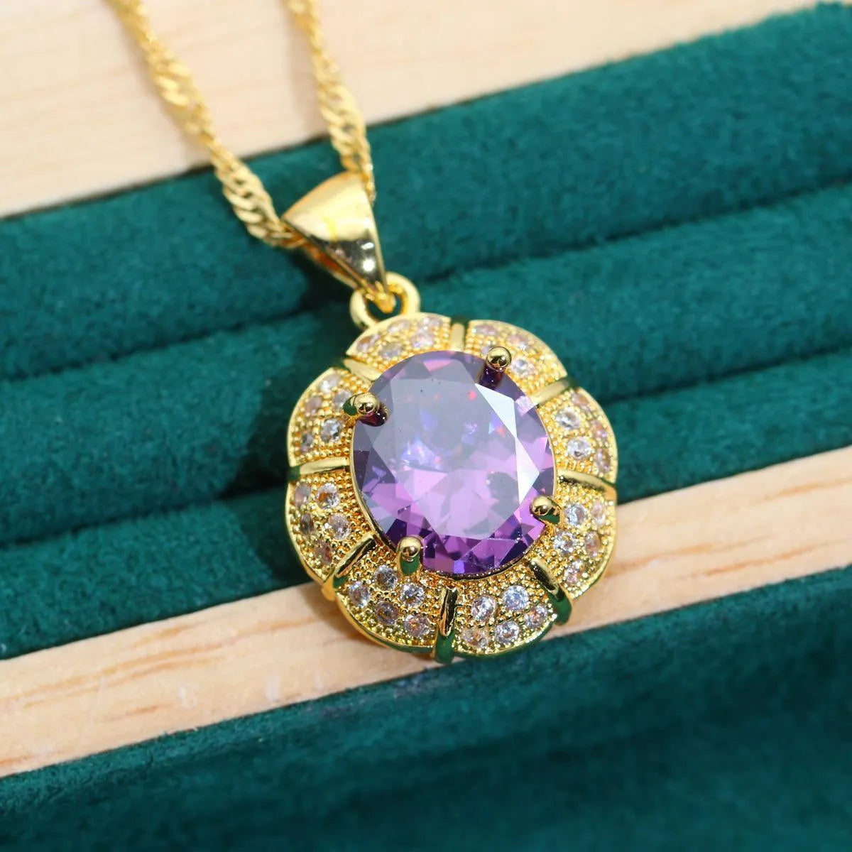Gold plated zircon jewellery set showing necklace, earrings, ring, and bracelet with coloured cubic zirconia stones.