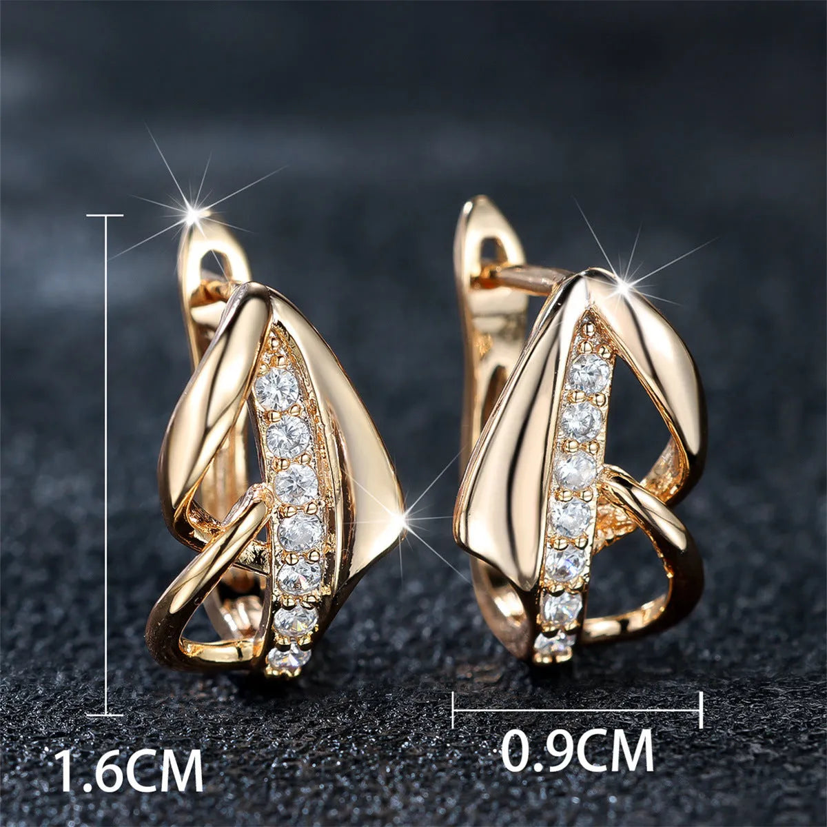 Copper geometric arrow ear clip in champagne gold with white diamond accent