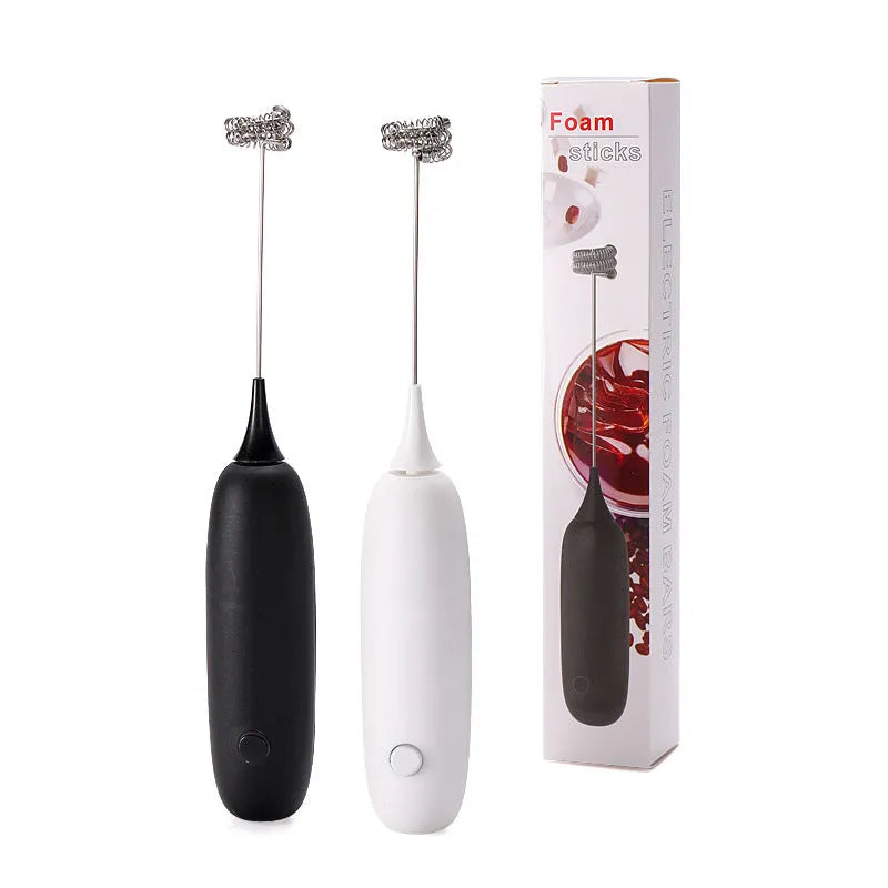 Black and white handheld electric milk frother blender for coffee preparation
