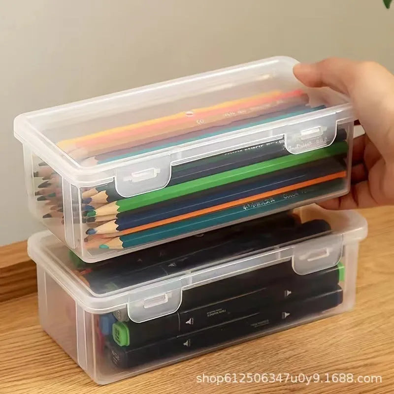 Transparent plastic pencil storage box showing interior space for organising stationery