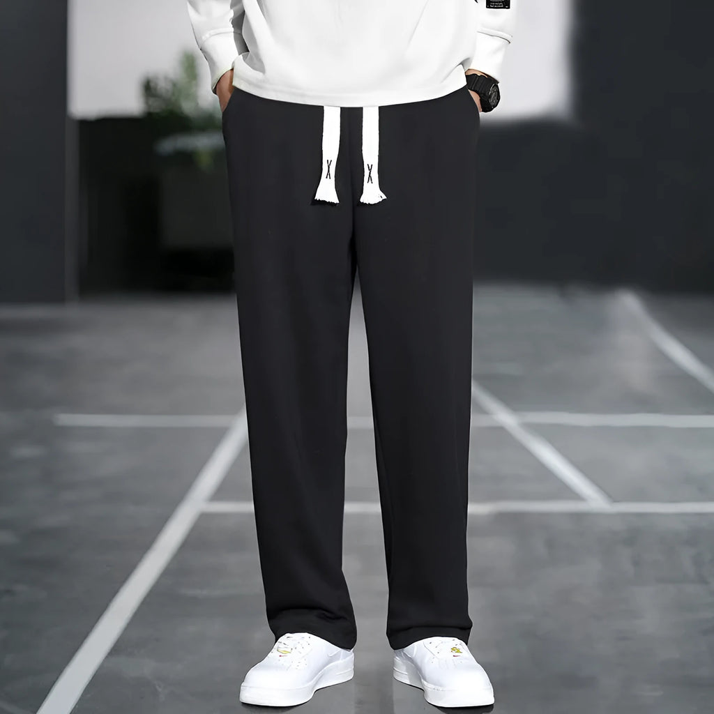 Men's grey casual bamboo fibre trousers with a high waist and multiple pockets.