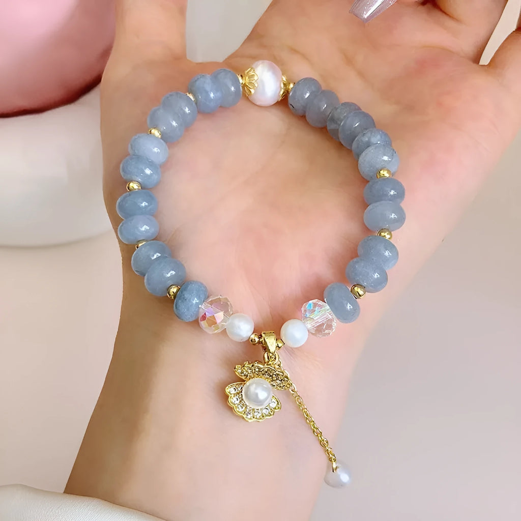 Natural aquamarine pearl and shell bracelet on adjustable stretch cord