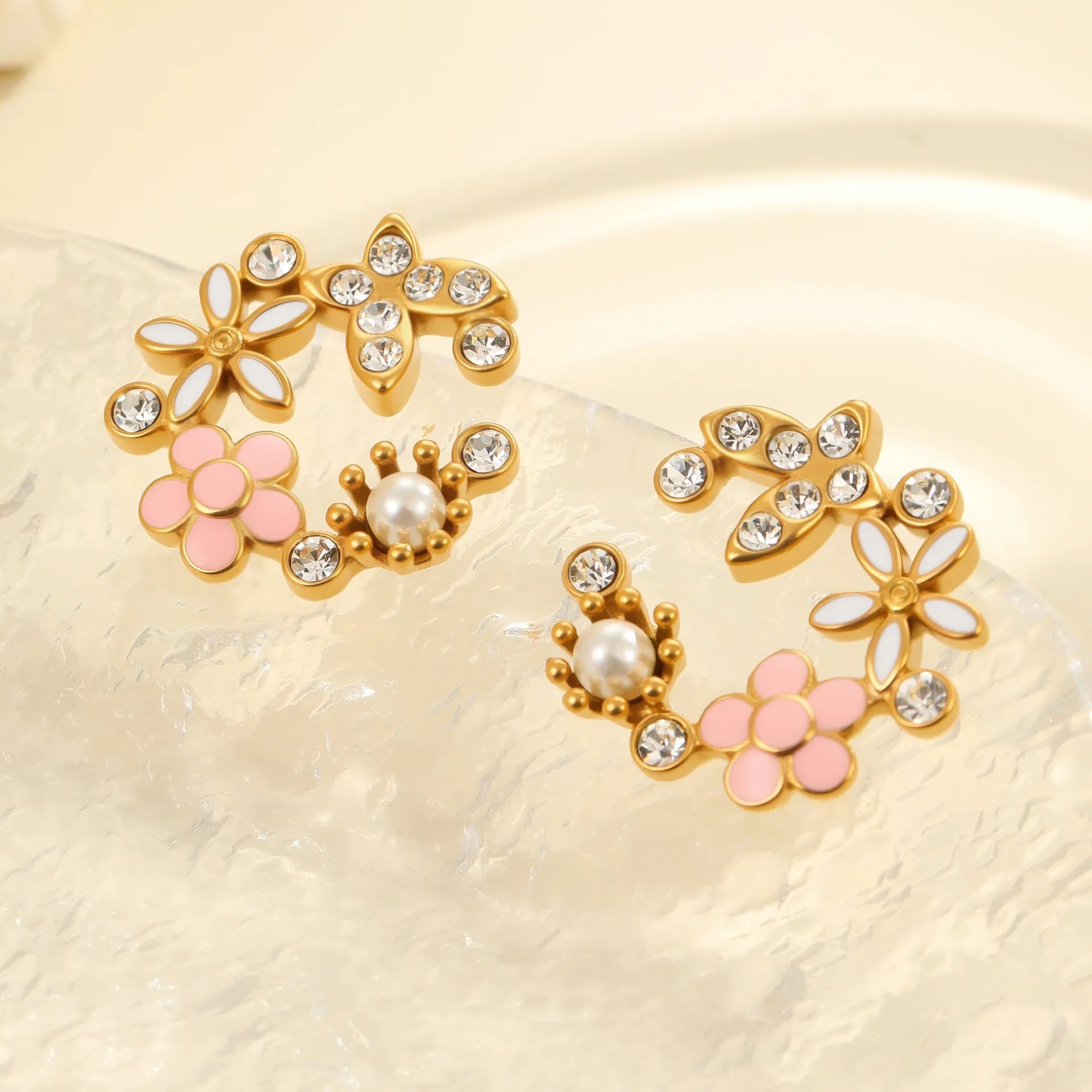 Colourful diamond flower stud earrings with gold plating and petal design