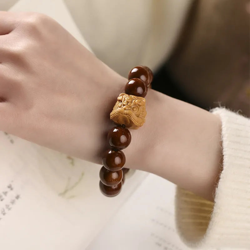 Hand-woven 13mm lion bead bracelet in ivory nut, sandalwood or yellow gradient bodhi style