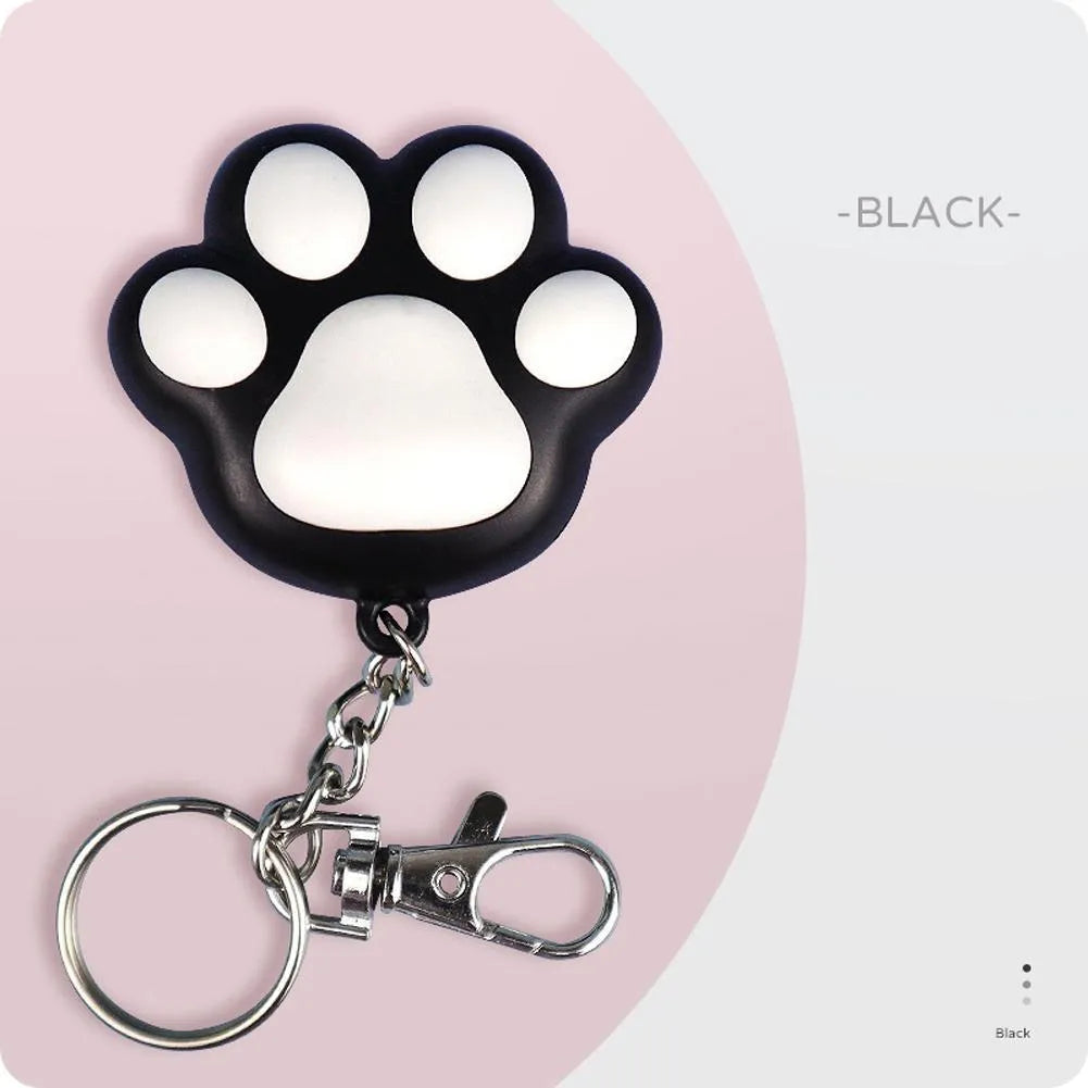 Small black or pink USB-rechargeable infrared cat teaser toy on a keychain, showing scale at 5cm.