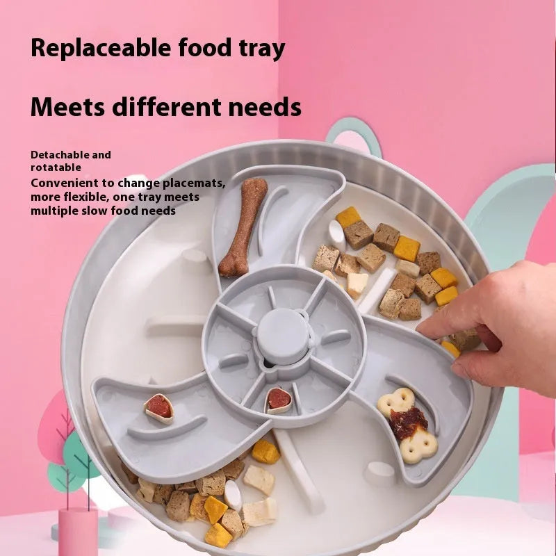 Grey rotating pet bowl with a windmill-pattern silicone licking mat insert for slow feeding.