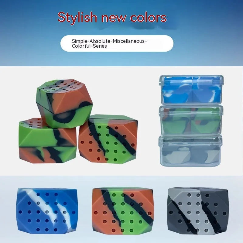 Two camouflage silicone facial muscle fitness balls for jaw training in a transparent box.