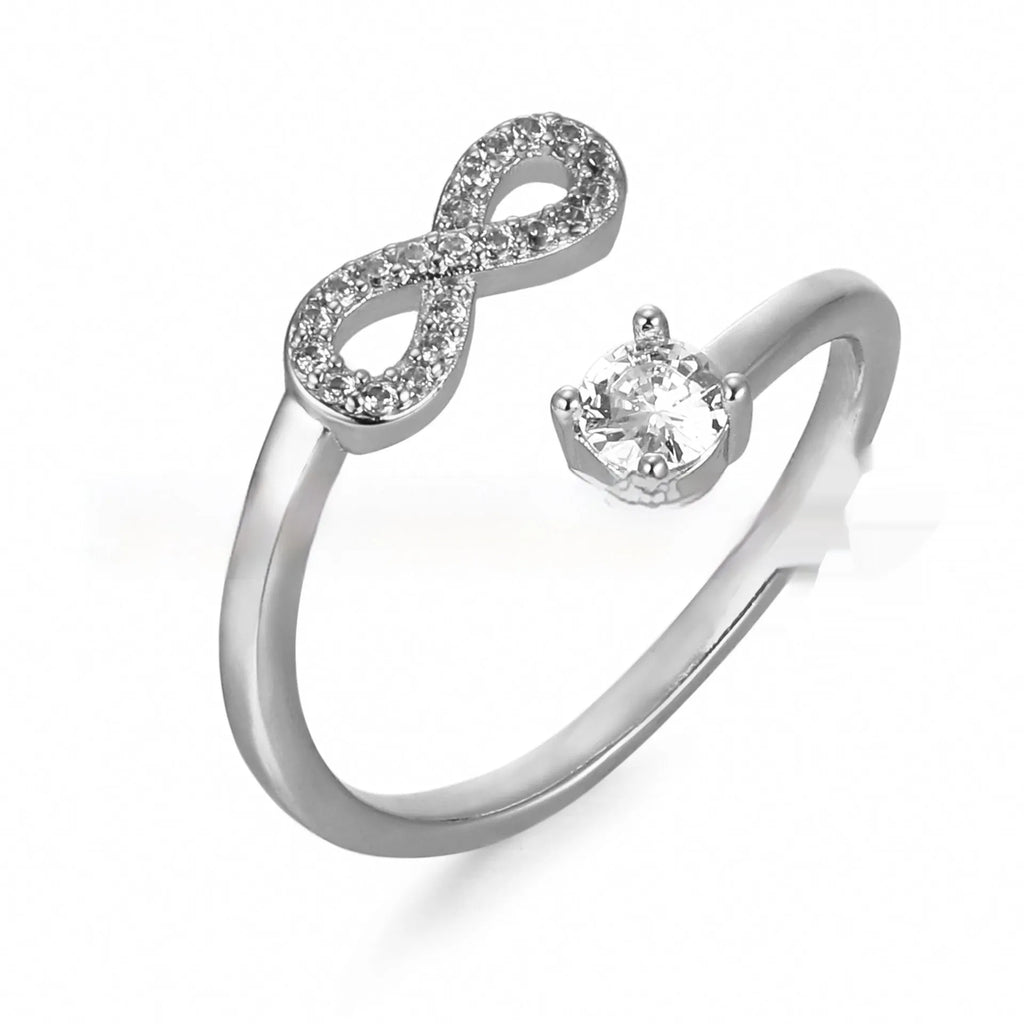 Open geometric ring with a custom 'A' letter made from inlaid zircon stones in a gold metal finish.