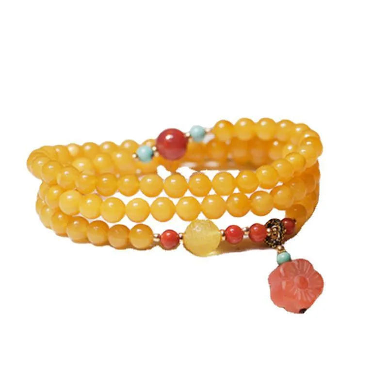 Yellow chicken grease beeswax amber bracelet with animal zodiac design in retro style