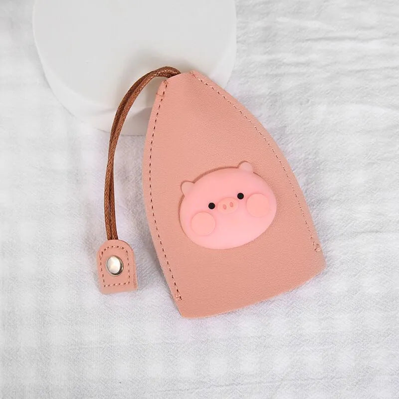Cartoon pull-out key case in PU leather measuring 14 x 7.5 cm with colourful designs