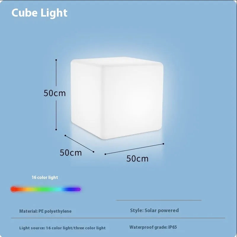 A modern, square white LED cube light functioning as a waterproof outdoor stool.
