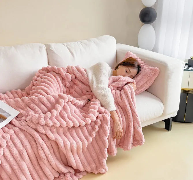 Double-sided bubble velvet blanket in rabbit fur design showing texture detail and solid colour option