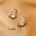 Geometric hoop earrings with hemp rope elements in gold or silver copper finish