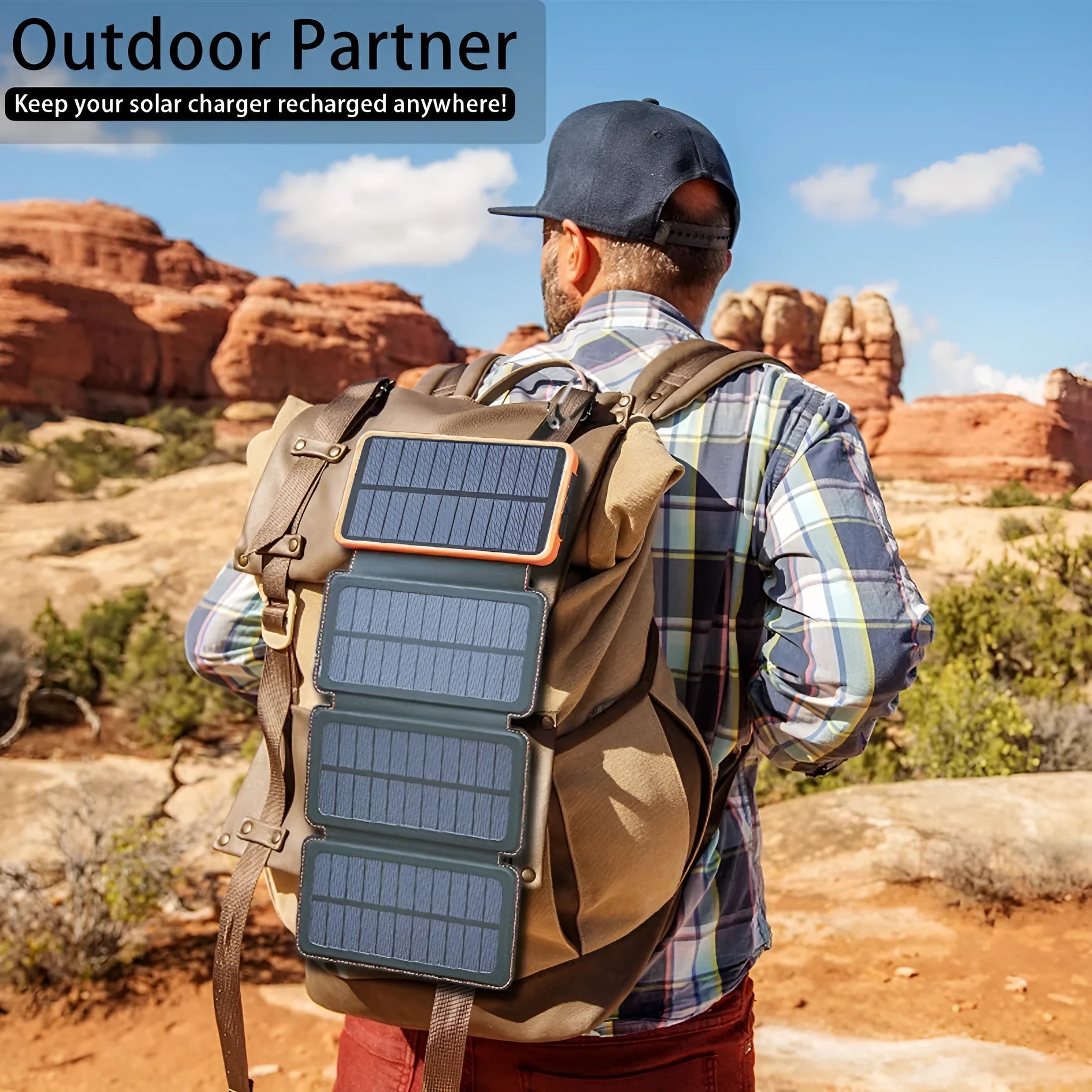 Black outdoor solar power bank with a solar panel and a built-in LED light displayed on a rock.