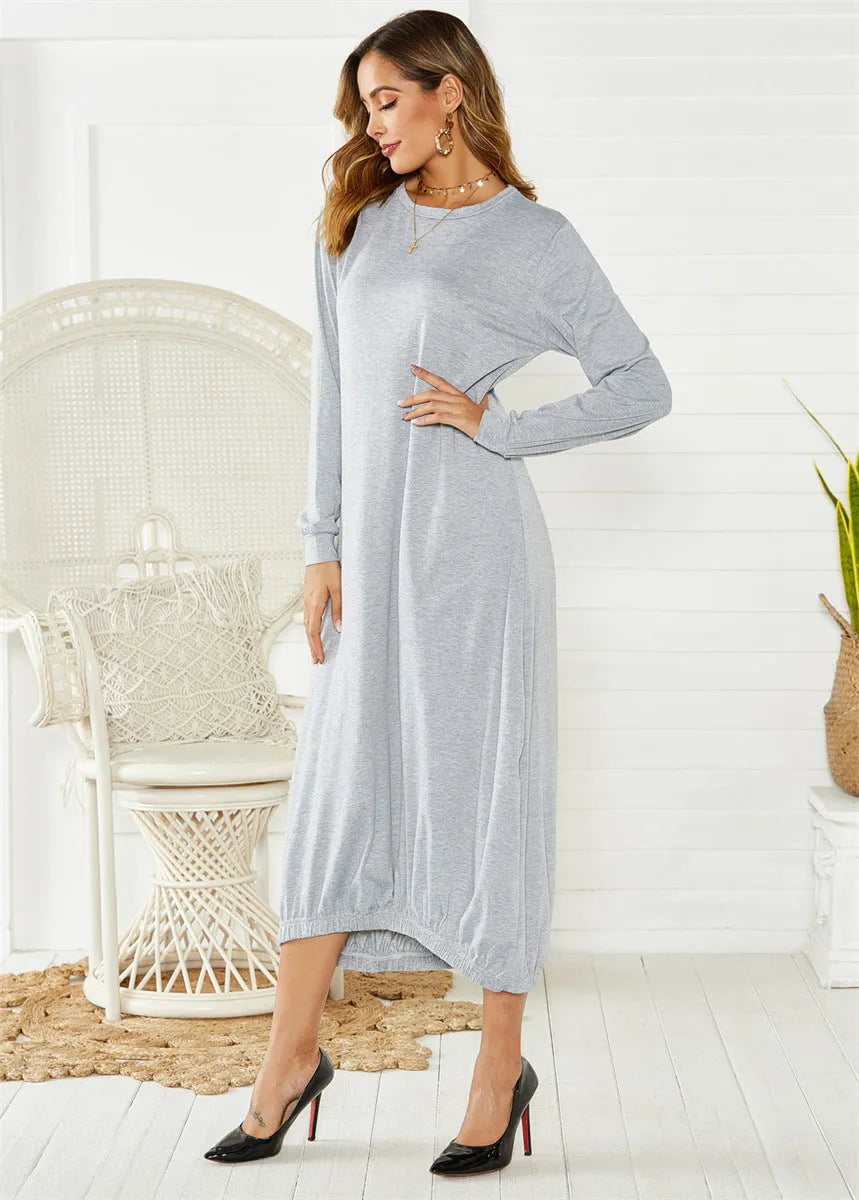 A loose black lantern dress with a lace-up crew neck, made from knitted polyester fabric.
